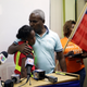 Rony Ponthieux, right, hugs his daughter, 10, during a news conference in favor of extending TPS. Rony has been in the US for 18 years on TPS status.